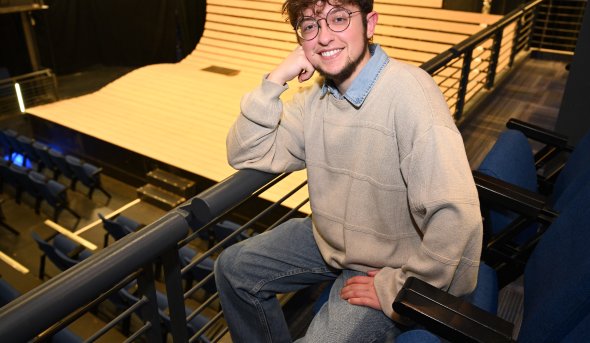 A photo of Taylor Tousignant in a theater.