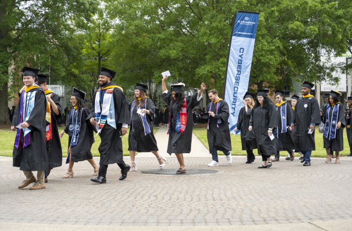 Graduates cross the ODU seal in 2024.